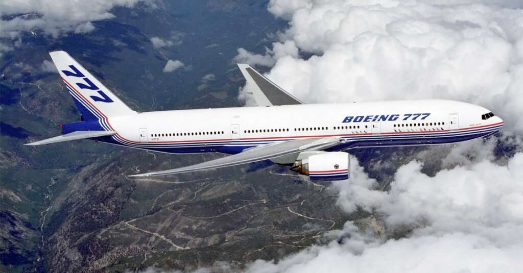 Boeing_777_above_clouds,_crop